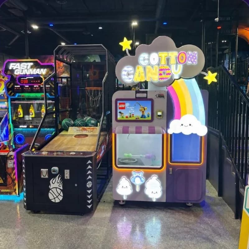 A cotton candy machine on the arcade floor at an Altitude trampoline park.