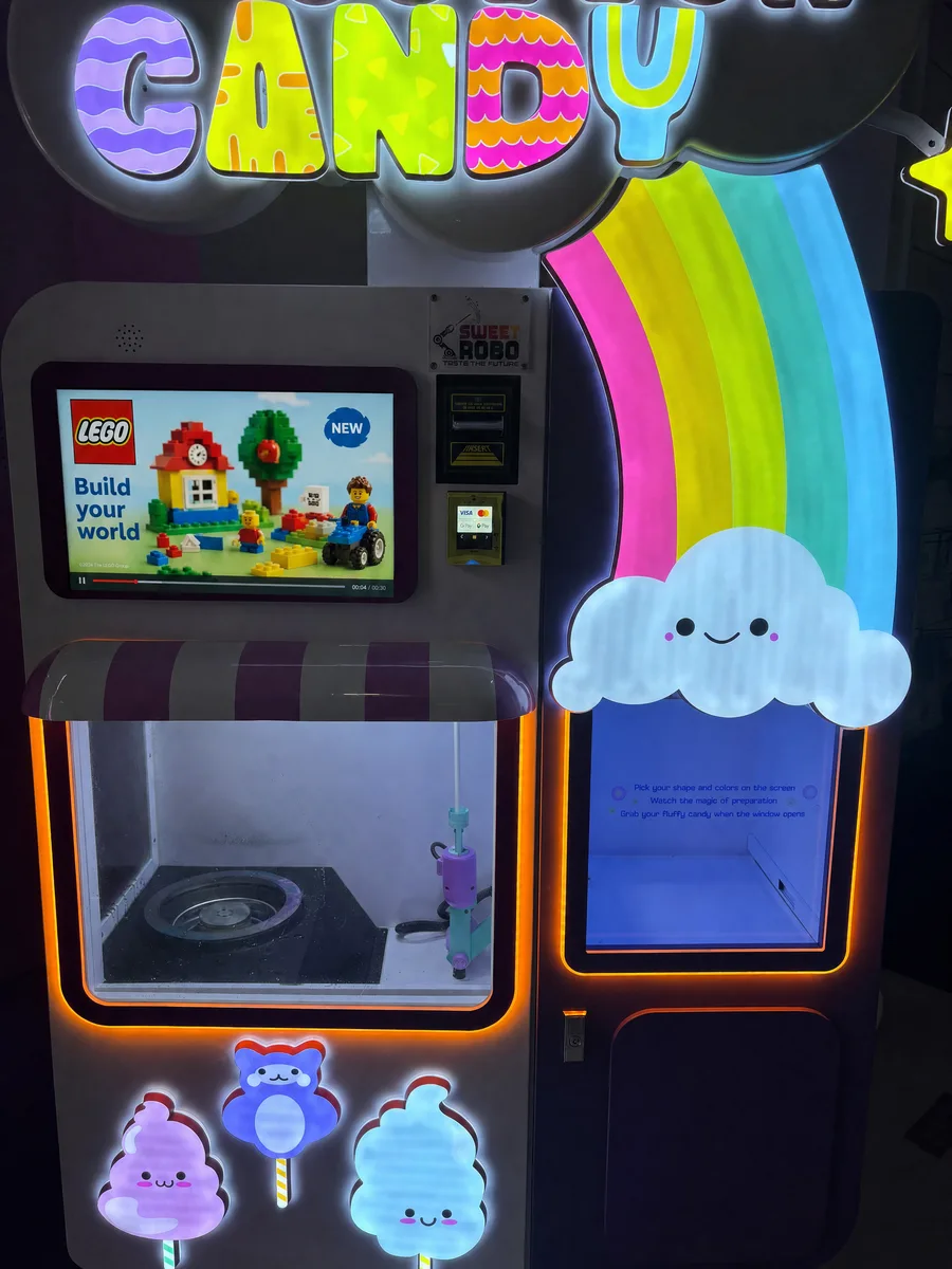 The same machine with a LEGO advertisement on the screen.