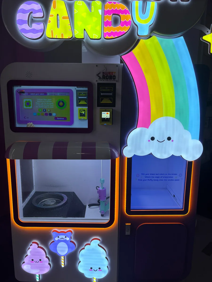 A cotton candy machine, its screen showing the flavour-picker it ships with.